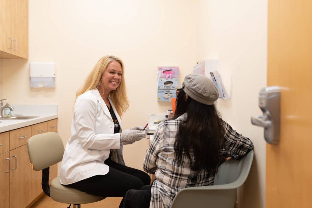 woman receiving a consultation at skin spot laser club and getting labs done