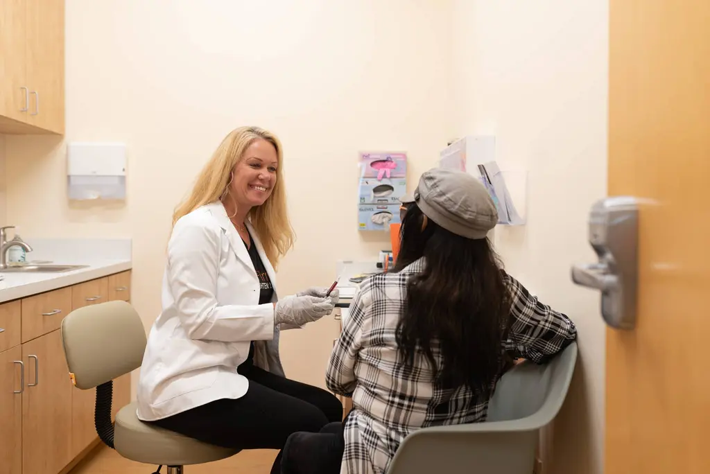 woman receiving a consultation at skin spot laser club and getting labs done