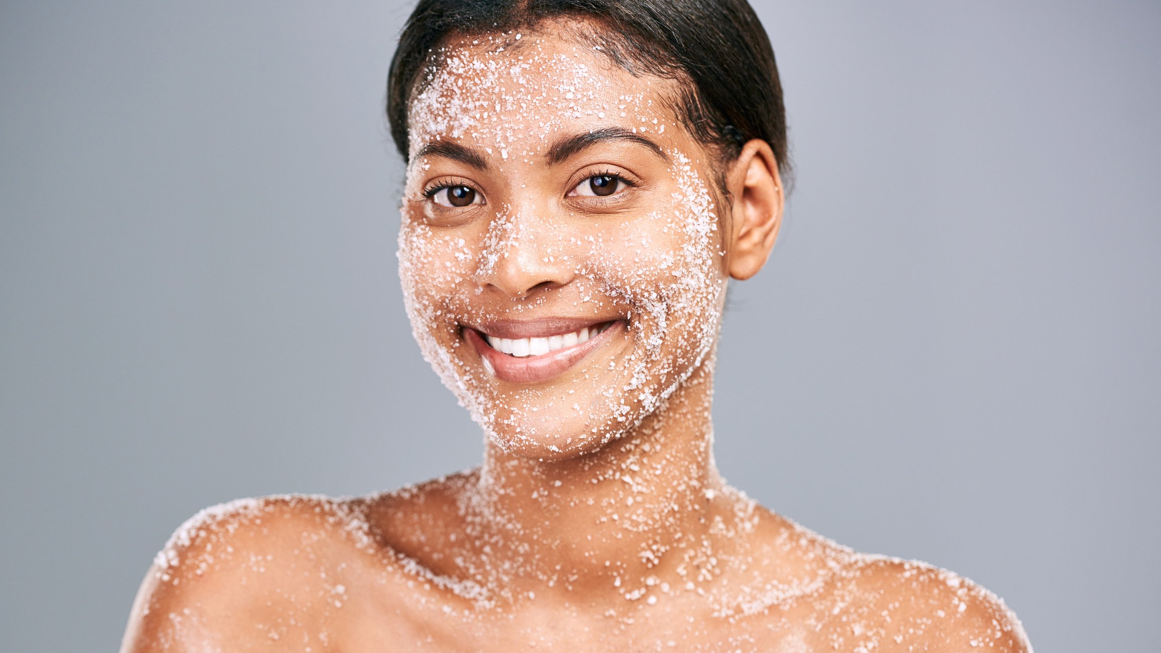Studio shot of a beautiful young woman using sea salt in her beauty routine