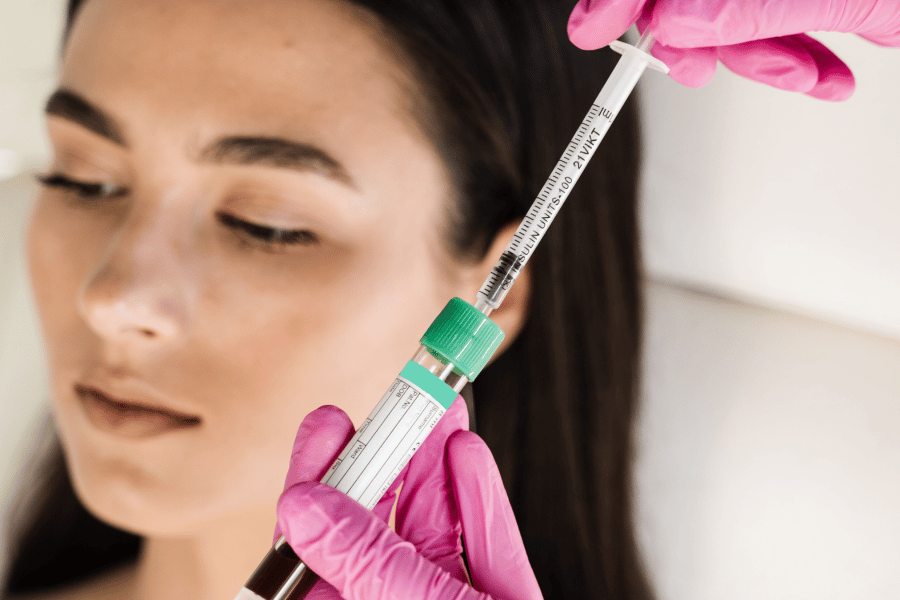 woman about to receive biofiller injection with plasma tube in the foreground